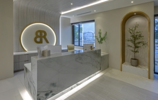 Custom reception desk in med spa with modern architectural lighting